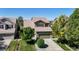 Attractive two-story home with lush landscaping, a driveway, and an attached two-car garage at 9255 Melborne Ct, Parker, CO 80134