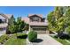 Charming two-story home featuring a well-manicured lawn and mature trees in a desirable neighborhood at 9255 Melborne Ct, Parker, CO 80134