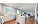Kitchen with stainless steel appliances, a center island, and a breakfast bar overlooking the living area at 9255 Melborne Ct, Parker, CO 80134