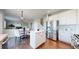 Open-concept kitchen with stainless steel refrigerator and adjoining living space at 9255 Melborne Ct, Parker, CO 80134