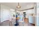 Eat-in kitchen featuring bright cabinets, modern appliances and hardwood floors at 9255 Melborne Ct, Parker, CO 80134