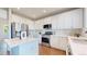 Well-equipped kitchen with stainless steel appliances, white countertops and ample cabinet space at 9255 Melborne Ct, Parker, CO 80134