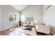 Bright, airy living room boasting hardwood floors, high ceilings and large windows at 9255 Melborne Ct, Parker, CO 80134