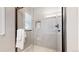 Modern bathroom shower features glass doors, gray tile, and built-in niche at 9255 Melborne Ct, Parker, CO 80134