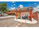 Backyard featuring a stone patio under a pergola with ample seating and a lush lawn at 9880 E 157Th Ave, Brighton, CO 80602