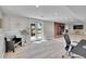 Bright basement featuring doors to the outside and fireplace with office at 9880 E 157Th Ave, Brighton, CO 80602