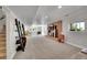 Spacious basement featuring a brick fireplace, stairs and carpeted floors at 9880 E 157Th Ave, Brighton, CO 80602