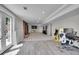 Another area in the basement with view of TV, fireplace, desk and egress to outdoors at 9880 E 157Th Ave, Brighton, CO 80602