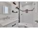 Bright bathroom featuring white subway tile shower with mosaic accents and floating shelves at 9880 E 157Th Ave, Brighton, CO 80602