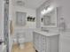 Bathroom featuring modern vanity, toilet, and tiled walk-in shower at 9880 E 157Th Ave, Brighton, CO 80602