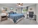 Cozy bedroom with blue plaid bedding, carpeted floors, and study desk at 9880 E 157Th Ave, Brighton, CO 80602