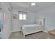 Cozy bedroom with a twin bed, neutral tones, and a window at 9880 E 157Th Ave, Brighton, CO 80602