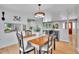 Cozy dining room with a stylish table set, wood floors, and a view to the kitchen at 9880 E 157Th Ave, Brighton, CO 80602