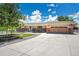 Charming ranch home featuring a well-maintained front yard and an attached two-car garage at 9880 E 157Th Ave, Brighton, CO 80602