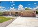 Charming ranch home featuring a well-maintained front yard and an attached two-car garage at 9880 E 157Th Ave, Brighton, CO 80602