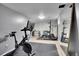 Home gym with cycling bike, weight rack and free weights at 9880 E 157Th Ave, Brighton, CO 80602
