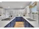 Open kitchen layout with stainless appliances, white countertops and a central island at 9880 E 157Th Ave, Brighton, CO 80602