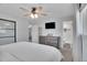 Bedroom with ceiling fan, ensuite bath, closet and drawers at 9880 E 157Th Ave, Brighton, CO 80602