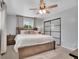 Spacious bedroom with ceiling fan, bedside tables, and closet at 9880 E 157Th Ave, Brighton, CO 80602