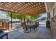 Outdoor patio with shaded dining and lounging area, perfect for entertaining at 9880 E 157Th Ave, Brighton, CO 80602