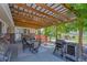 Outdoor patio with dining table, barbecue grill and shaded area at 9880 E 157Th Ave, Brighton, CO 80602