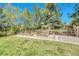 Backyard garden with raised garden beds and a wooden fence surrounding the property at 5255 Ridge Trl, Littleton, CO 80123