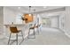 Basement bar with granite countertop, wood cabinetry, and barstool seating at 5255 Ridge Trl, Littleton, CO 80123