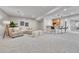 Finished basement boasting a full bar, seating area, and carpet flooring at 5255 Ridge Trl, Littleton, CO 80123