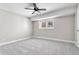 A bedroom with carpet flooring, neutral walls, and a window letting in natural light at 5255 Ridge Trl, Littleton, CO 80123