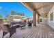 Large backyard deck featuring brick columns, wood flooring and an outdoor seating area at 5255 Ridge Trl, Littleton, CO 80123