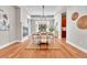 Formal dining area with a contemporary chandelier, hardwood floors, and access to a butler's pantry at 5255 Ridge Trl, Littleton, CO 80123