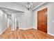Bright foyer with hardwood floors, modern lighting, and a glimpse of the home's interior layout at 5255 Ridge Trl, Littleton, CO 80123