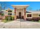 Inviting front entrance with brick pillars, stylish lighting, and a solid wood door with sidelight windows at 5255 Ridge Trl, Littleton, CO 80123
