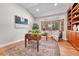 Inviting home office with custom built-ins, wood floors, and abundant natural light at 5255 Ridge Trl, Littleton, CO 80123