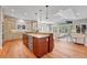 Spacious kitchen with a large island, stainless steel appliances, and a view into the living area at 5255 Ridge Trl, Littleton, CO 80123