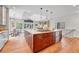 Well-lit kitchen with a central island, breakfast nook, and modern appliances, perfect for Gathering meals at 5255 Ridge Trl, Littleton, CO 80123