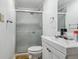 Bathroom showcasing a white vanity with brushed chrome hardware and a glass-enclosed shower at 19560 E 18Th Pl, Aurora, CO 80011