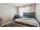 Comfortable bedroom features a large window, desk and cool LED lighting at 19560 E 18Th Pl, Aurora, CO 80011