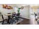 Dining area boasts wood floors, a rustic table, and stylish seating at 19560 E 18Th Pl, Aurora, CO 80011
