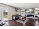 Modern living room with stylish fireplace, mounted TV, and contemporary decor at 19560 E 18Th Pl, Aurora, CO 80011