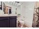 Clean bathroom with vanity, toilet, and bathtub-shower combination at 10602 W Patterson Pl, Littleton, CO 80127