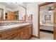 Bathroom featuring a double sink vanity with wood cabinets and granite countertops at 2164 Foothills S Dr, Golden, CO 80401