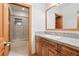 Bright bathroom with granite counter top vanity, tiled floors and a glass enclosed shower at 2164 Foothills S Dr, Golden, CO 80401