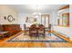 Traditional dining room features a wooden table, ornate rug, and elegant chandelier at 2164 Foothills S Dr, Golden, CO 80401