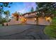 A two-story house with a three car garage, and lovely curb appeal at 2164 Foothills S Dr, Golden, CO 80401