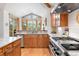 Beautiful kitchen with stainless steel appliances, granite countertops, and a large picture window for scenic views at 2164 Foothills S Dr, Golden, CO 80401