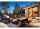 Inviting outdoor patio with stylish seating and grill, perfect for dining and enjoying the serene surroundings at 2164 Foothills S Dr, Golden, CO 80401