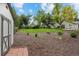 Large backyard with a shed and mature landscaping at 560 Front Range Rd, Littleton, CO 80120