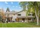 Spacious backyard features an outdoor seating area perfect for entertaining guests at 560 Front Range Rd, Littleton, CO 80120