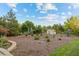 Backyard with mature trees, shrubs and shed at 560 Front Range Rd, Littleton, CO 80120